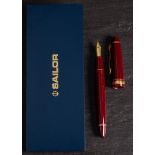 A Sailor (Japan) 1911 fountain pen: with 21k gold nib, maroon body and gilt mounts in original case.