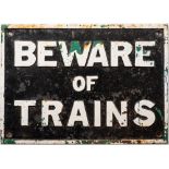 A cast iron railway sign 'Beware of Trains': white text on black ground, 35 x 49cm.