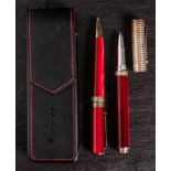 A Montegrappa 1912 roller ball and ball point pen: in red marbled finish with silver mounts,