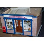 A 20th Century doll's shop 'General Store' with fitted interior, figures and accessories.