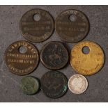 An accumulation of miscellaneous coins: including four numbered tags for 'Launton & Co