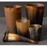 A group of four 19th century horn beakers: all of plain design,