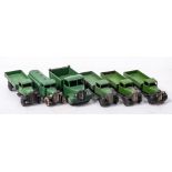 A group of four early Dinky flatbed lorries: together with a pre-war petrol wagon and a 1950's
