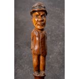 A 19th century Folk Art walking cane of a man in hat: inset glass eyes and standing full length in
