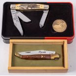 A boxed Laguiole No 1421 pocket knife: with brass inlaid two piece wooden grip,