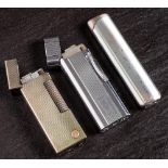 A Vintage Dunhill rollergas lighter: with silver plated milled body,