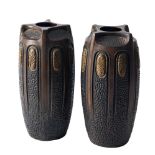 A pair of Bretby 'Clanta' pottery vases: of moulded and vertically ribbed oviform decorated with