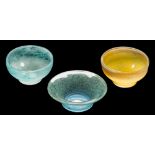 Ysart glass, three circular bowls: one yellow with a speckled grey rim,