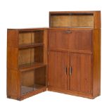 A 'Minty' oak corner bookcase:, with a three section, having glazed (sliding) doors, 71cm wide,
