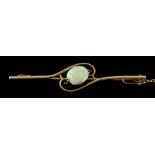 An opal single-stone bar brooch: the reverse stamped '15ct', approximately 4gms gross weight.