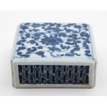 A Chinese blue and white reticulated stand: of square section with pierced sides,