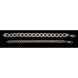A large silver curb-link bracelet together with a smaller,