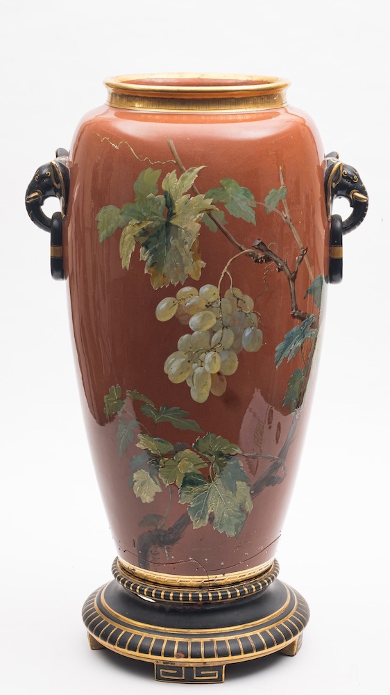 A large Minton terracotta ground floor vase by William Mussill and stand: with elephant head ring