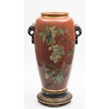 A large Minton terracotta ground floor vase by William Mussill and stand: with elephant head ring