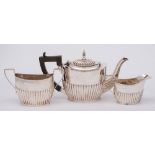 An Edward VII silver three-piece bachelor's tea service, maker William Aitken, Birmingham,