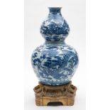 A Chinese ormolu-mounted blue and white double gourd 'dragon' vase: painted with dragons amongst