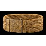 A plaited hair bracelet with foliate gold clasp: approximately 25mm wide, 22.5gms gross weight.