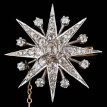 A silver and gold backed, diamond-set star burst brooch: set with graduated,