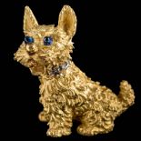 An 18ct gold and gem-set 'Scottie Dog' brooch: set with cabochon sapphire eyes and diamond-set