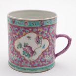 A Chinese famille rose cylindrical mug for the Straits market: painted with panels of peony sprays