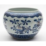 A Chinese underglaze blue and copper-red bowl: of compressed globular form,