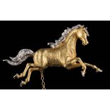 An 18ct gold and diamond-set two tone 'galloping horse' brooch: mane and tail set with single-cut