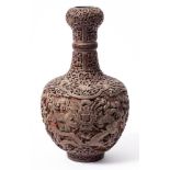 A Chinese cinnabar lacquer garlic-neck 'dragon' bottle vase: decorated with dragons chasing flaming