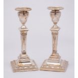 A pair Edward VII silver candlesticks, maker Thomas A Scott, Sheffield 1902: in neo-classical style,