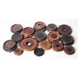 A mixed group of Oriental wooden stands: of carved and pierced circular form.