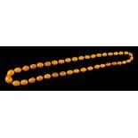 An amber bead single-string necklace: comprising forty individually knotted oblong beads,