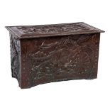 An Arts and Crafts embossed copper rectangular trunk of Newlyn type:,