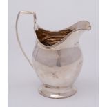 A George III silver helmet shaped cream jug, maker I.