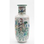 A Chinese famille verte 'Tribute Bearers' rouleau vase: painted overall with figures holding