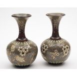 A pair of Doulton Lambeth Silicon-ware bottle vases by Edith Lupton: decorated with flower sprays,