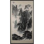 A Chinese painting, signed Guanyi [Kai Pingzhou]: depicting a mountainous landscape with waterfall,