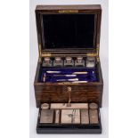 A Victorian coromandel wood and brass mounted toiletry box: the hinged lid with mirror and