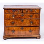 An early 18th Century walnut and feather banded rectangular chest:,