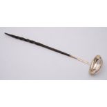 A Georgian silver toddy ladle, unmarked: with coin inset to the oval bowl,