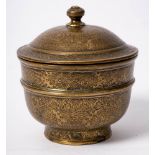 An Ottoman brass bowl and cover: engraved and chased overall with foliate cartouches on a ground of