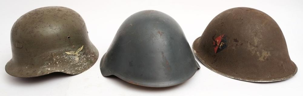 A MKIII 'turtle' steel helmet: together with a Czechoslovakian steel helmet and a reproduction