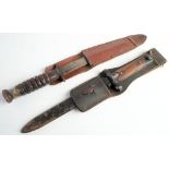 A WWII American M3 Utica fighting knife: clipped back blade stamped 'US M3 Utica' steel hilt and