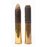 A pair of WWI 18pdr artillery shells with casings and fuses (2): (fuses loose)