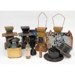 Two WWII period headlamp blackout shrouds,: together with four signal lamps, a child's gas mask,