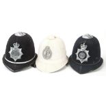 A New Zealand Police Force helmet: white Home Service pattern with silver plated helmet plate,