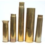 A WWI 3.1 inch shell casing dated 1916: two WWII 3 inch shell casings, a 4.