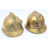 Two early 20th century French Fire Service brass helmets: for 'Indre et Loire' and 'De Germaine',