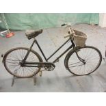 A Raleigh all steel bicycle: step through frame with plated handlebars, bar brakes,