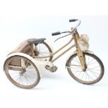 A Raleigh 'Winkie' tricycle: in gold and white,