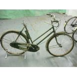 A Raleigh all steel bicycle: step through frame with plated handlebars, lever brakes,