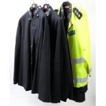 Three Devon and Cornwall Constabulary capes and a later Police high visibility vest: